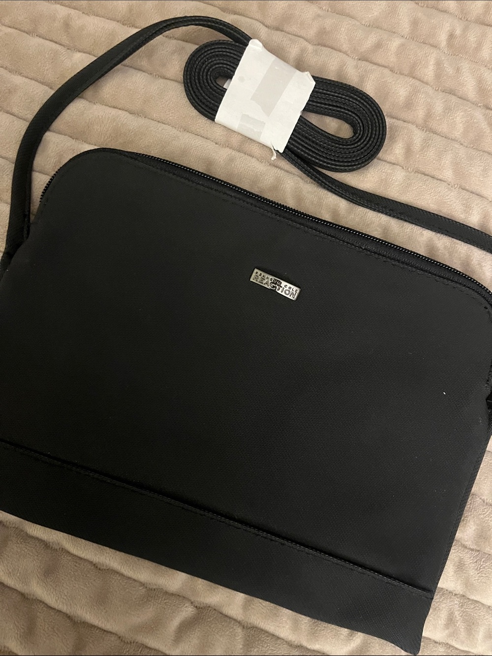 Kenneth Cole Reaction Minimalist Black crossbody Bag with Subtle Metal Accent